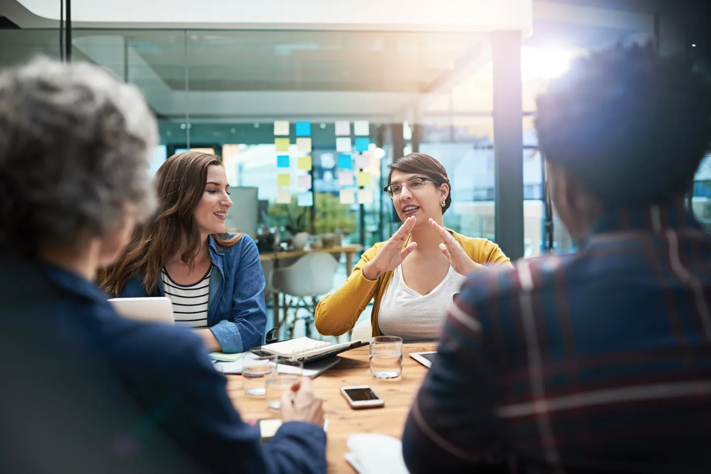 team of creative businesspeople brainstorming around a table