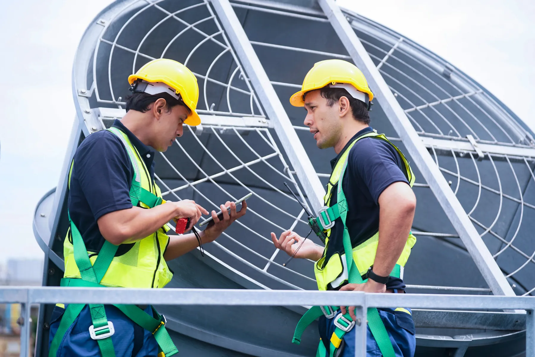 technicians doing maintenance and repair of cooling towers