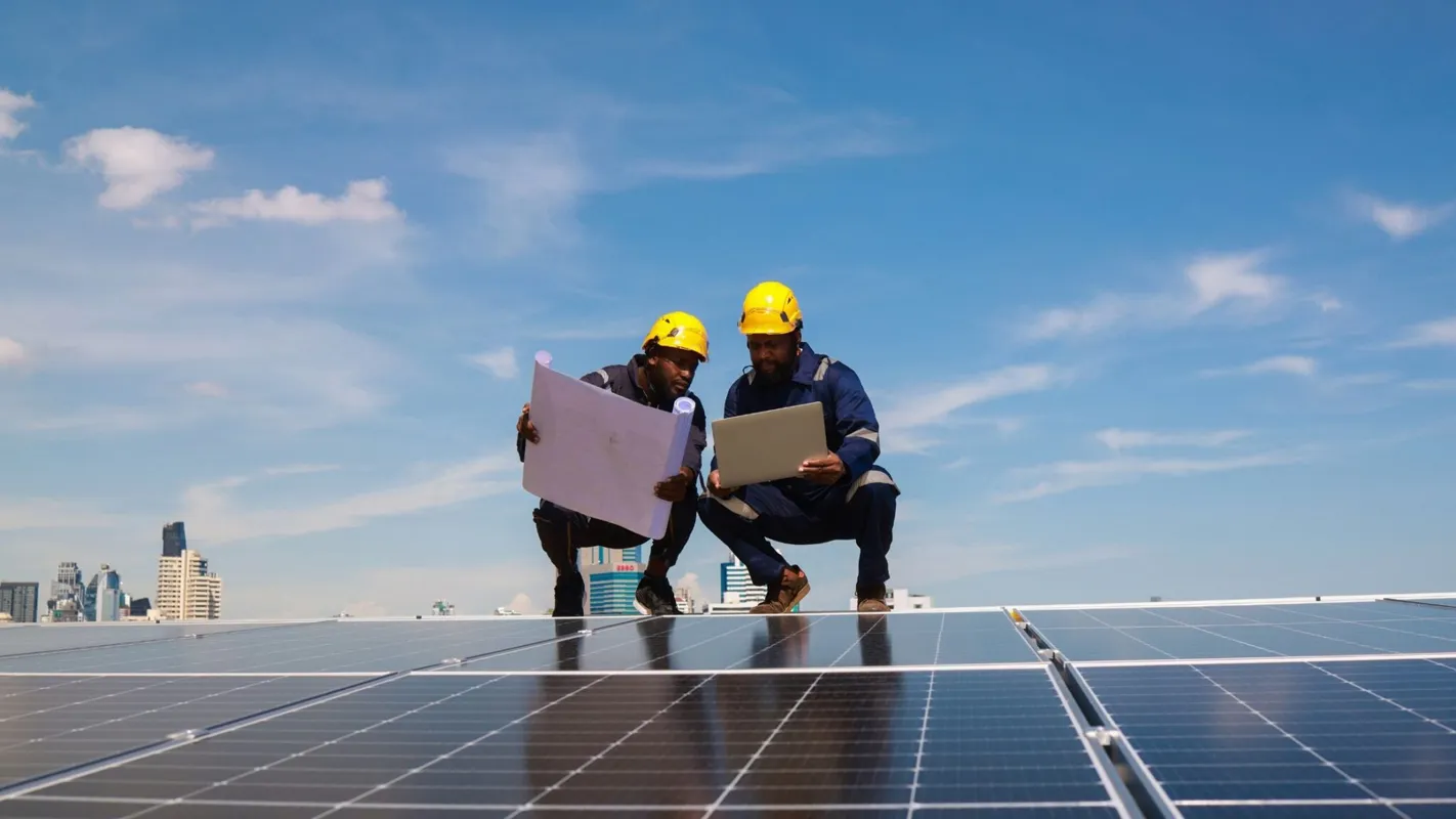 solar panel techs checking plans