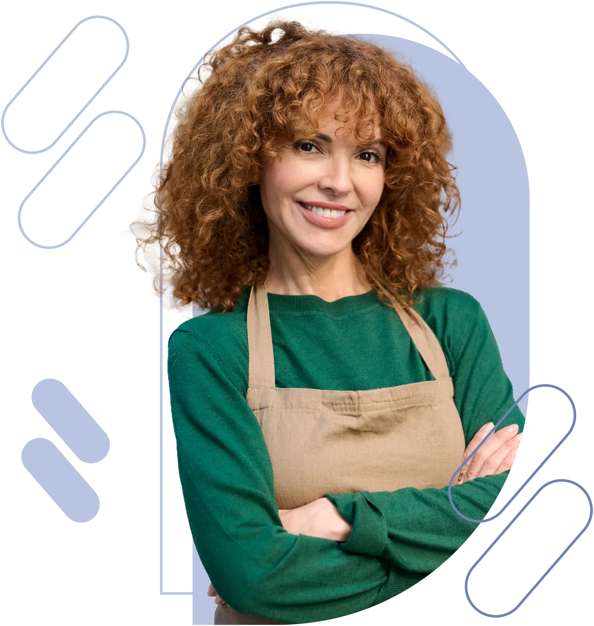 woman wearing green shirt with tan apron smiling