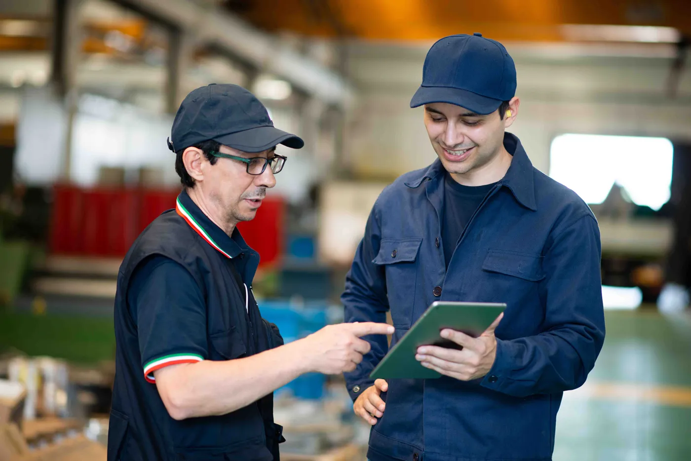 manager reviewing with tech